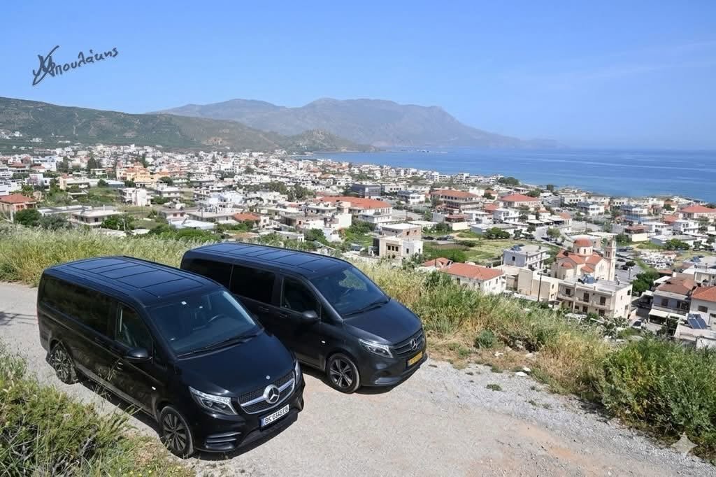 Two Horizon Transfers Mercedes V-Class vans on a hill above Kissamos town and bay, Chania, Crete